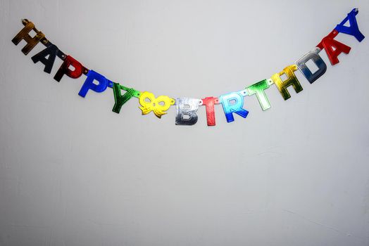 white wall and an inscription happy birthday