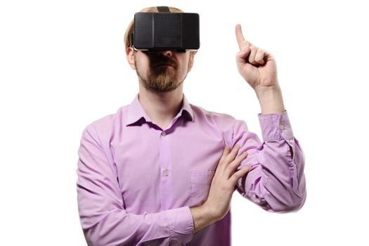 nice man with glasses of virtual reality in a lilac shirt on white background.