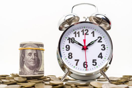 Retro alarm clock, bundle of money and coins . Retirement planning. money saving and Investment. White background