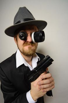 crazy beard detective whit gun in hat at white background