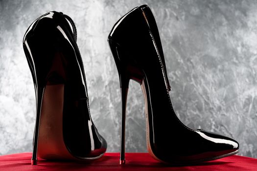 Black fetish shiny patent leather stiletto high heels with ankle strap - image