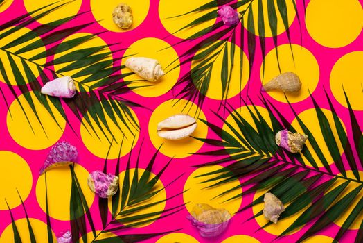 Flat lay traveler accessories with palm leaf, seashells . Top view travel or vacation concept. Summer background.