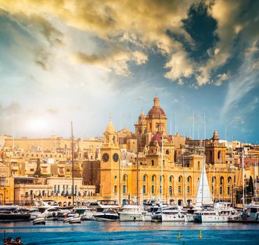 beautiful view on Birgu and the harbour with colorful boats in Malta