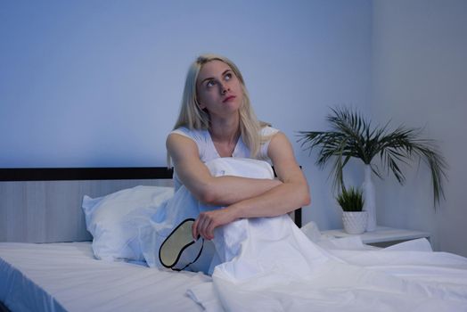 Sleep Disorders, insomnia. Woman Suffering From Depression Sitting On Bed In Pajamas - Image
