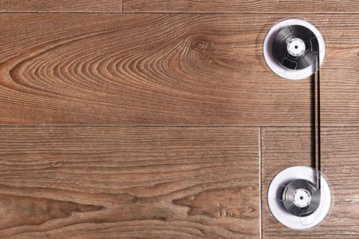 Magnetic tape on old wooden background