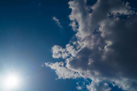 The sun shines bright in summer. Blue sky and clouds.- image