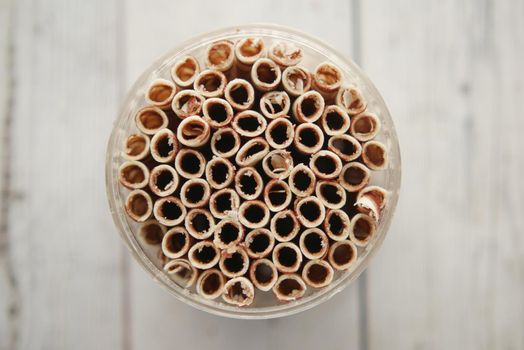 top view of wafer roll chocolate in container .