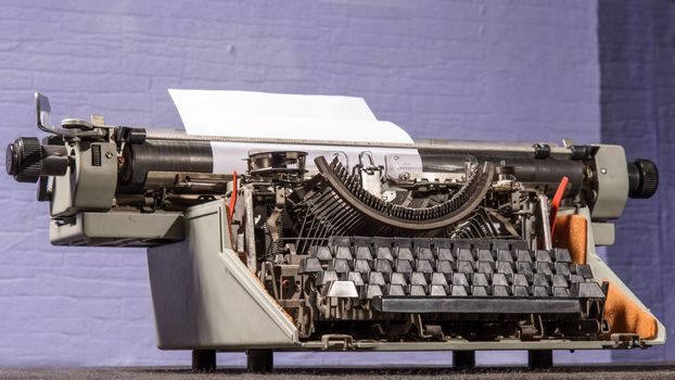 Retro styled image of an old typewriter on a table