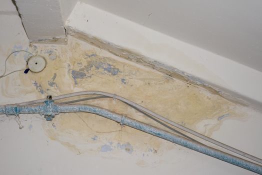 Big wet spots and cracks and black mold on the wall of the domestic house room after heavy rain and lot of water - Image