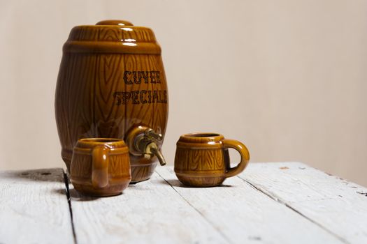 ceramic barrel and mug on the white table