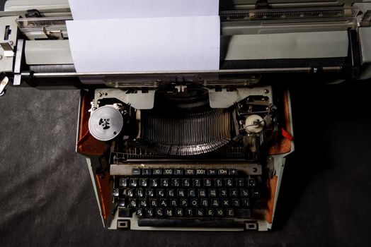 Retro styled image of an old typewriter on a table