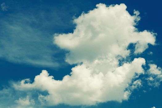 Incredibly wonderful lush cumulus clouds against a blue sky - Image toned