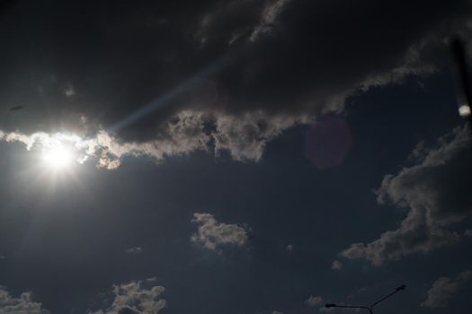 The sun shines bright in summer. Blue sky and clouds.- image