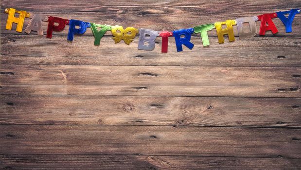Blue brown wall with the inscription Happy Birthday