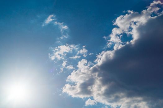 The sun shines bright in summer. Blue sky and clouds.- image