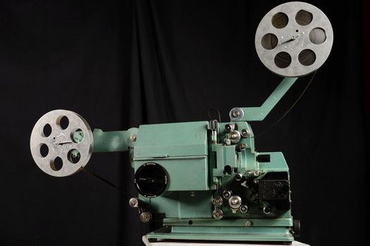 Old film projector on a white background