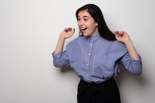 Portrait of surprised beautiful girl in casual wear. on white background.