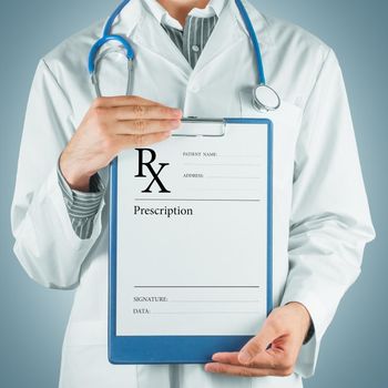 Unrecognizable man doctor gives clipboard with prescription paper