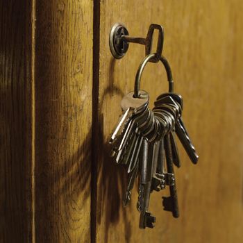 Keys in the lock of a old door. Internet data protection concept.