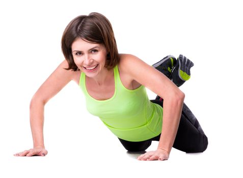 sport girl pressing-up off the floor isolated on white background