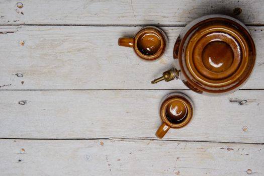 ceramic barrel and mug on the white table