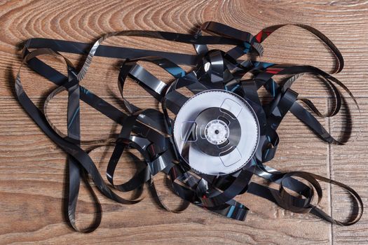 Magnetic tape on old wooden background