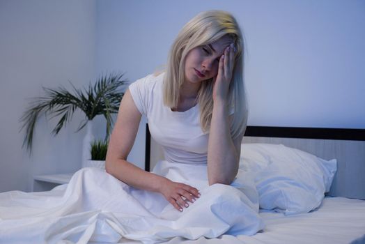 Depressed woman awake in the night, she is exhausted and suffering from insomnia - Image