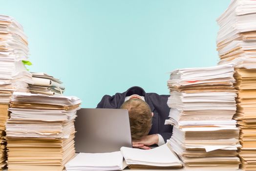 Close-up image of a stressful businessman tired from his work on the foreground - image