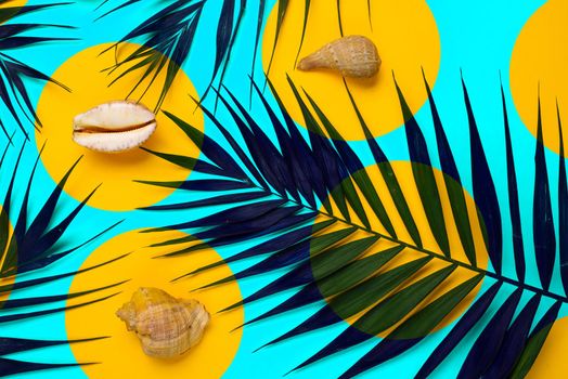 Flat lay traveler accessories with palm leaf, seashells . Top view travel or vacation concept. Summer background.