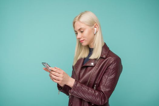 Tula, Russia - May 1, 2019: Happy woman listening music Apple AirPods wireless - Image