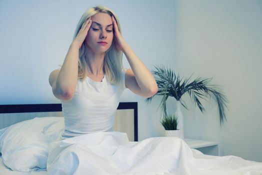 Depressed woman awake in the night, she is exhausted and suffering from insomnia - Image