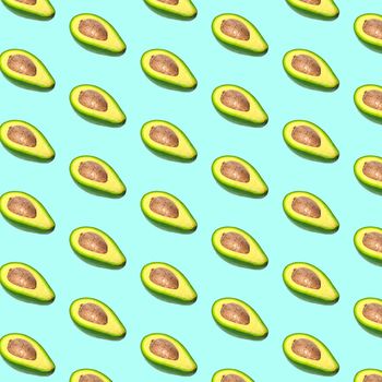 Avocado pattern on color background. Top view. Banner. Pop art design, creative summer food concept