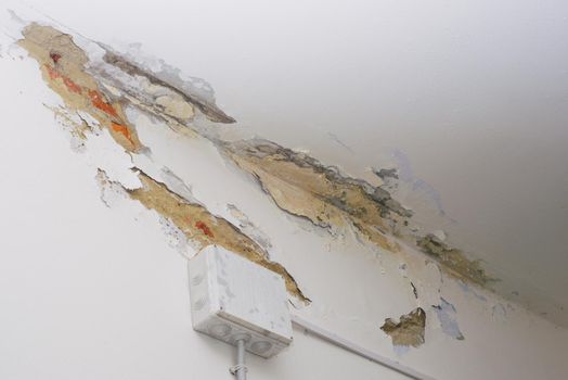 Damage ceiling from water pipelines leakage. Housing problem concept - image
