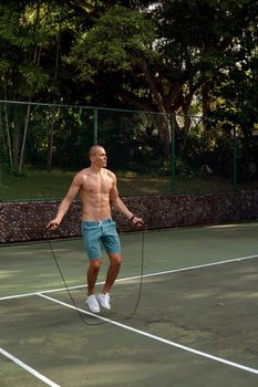 a man doing with rubber bands. bali