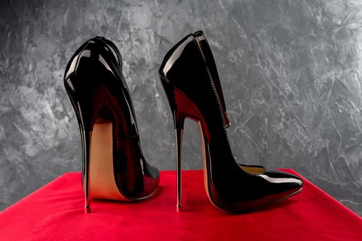 Black fetish shiny patent leather stiletto high heels with ankle strap - image