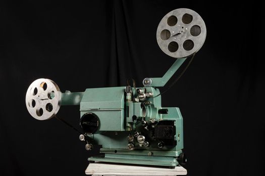 Movie projector with the film on the white background