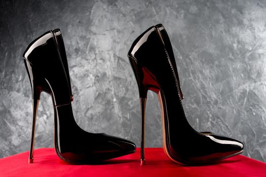 Black fetish shiny patent leather stiletto high heels with ankle strap - image