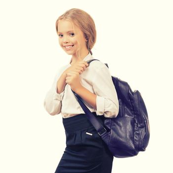 Young smiling happy school girl child with backpack in uniform isolated on a white background with copyspase