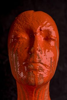 The head of a female mannequin is doused with paint. Brain tumor and disease concept, alzheimer's disease or schizophrenia