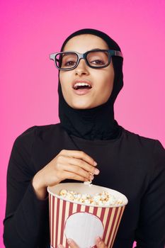 pretty woman attractive look popcorn glasses movie watching studio lifestyle. High quality photo