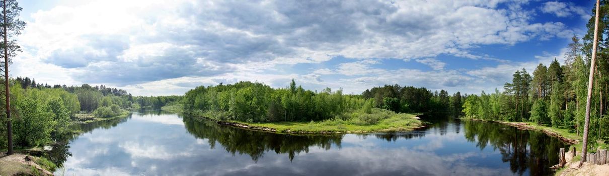 Panorama of a river flowing through a forest. Brikin bor. Russia