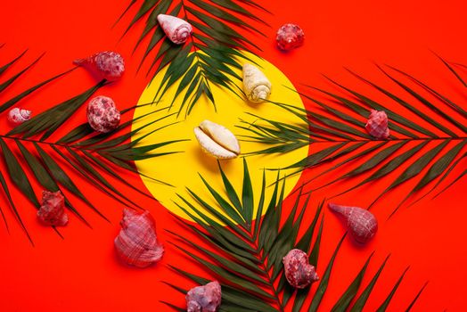 Flat lay traveler accessories with palm leaf, seashells . Top view travel or vacation concept. Summer background.
