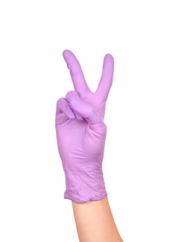 Hand peace gesture. Sign of victory. Hand in a purple latex glove isolated on white. Woman's hand gesture or sign isolated on white.