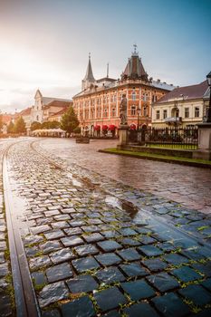 central square in Kosice with tram rails and paving stone after rain