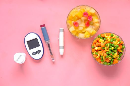 diabetic measurement tools and insulin pen on table .