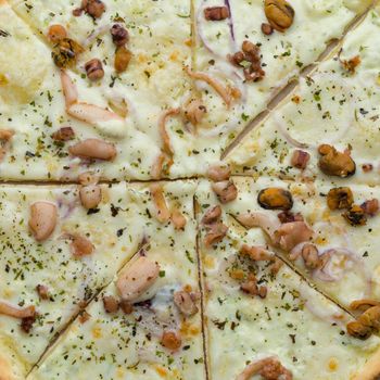 Close up Pizza with seafood. Top view isolated on a white background - image