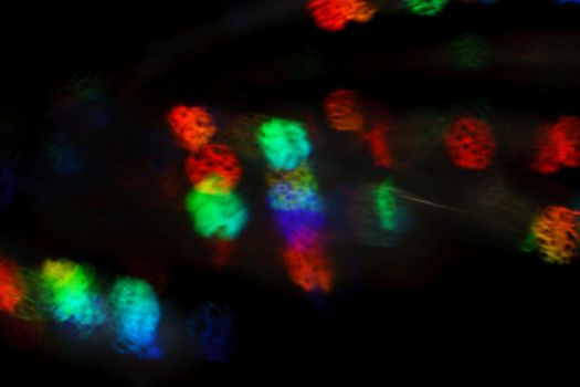 Christmas background. Festive abstract background with bokeh defocused lights and stars.
