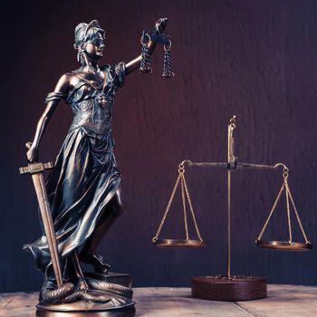 Law offices of lawyers legal statue Greek blind goddess Themis bronze metal statuette figurine with scales of justice. - Image