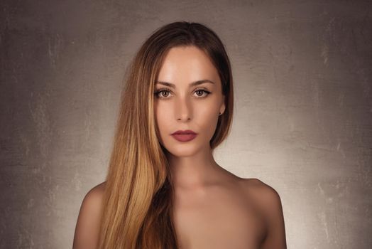Beauty portrait of model with natural make-up. Fashion shiny highlighter on skin, sexy lips make-up