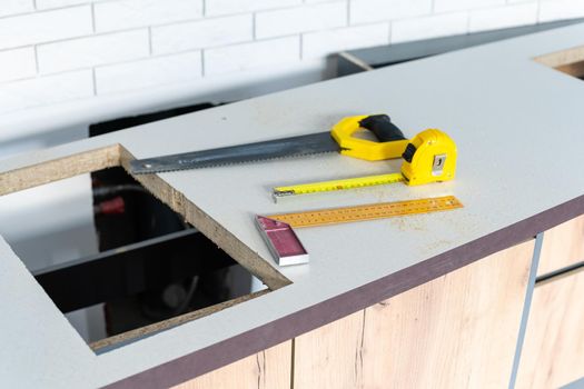 to cut holes in the kitchen countertop for equipment